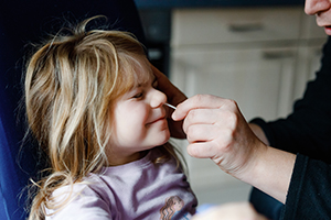 child getting swabbed