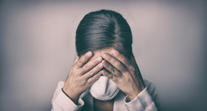 stressed woman in mask